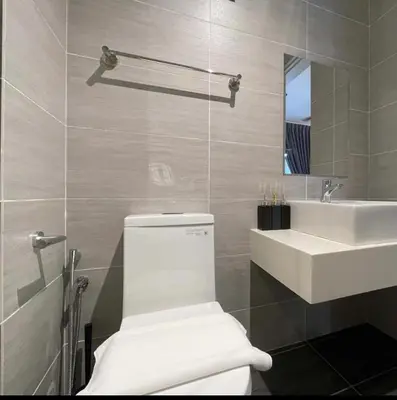 a bathroom with a white toilet and a sink at trion2 klcc in Kuala Lumpur