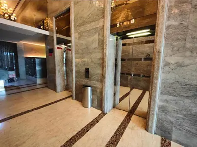 an empty lobby with columns in a building at Chelsea Residence Studio, Plaza Damas 3 in Kuala Lumpur