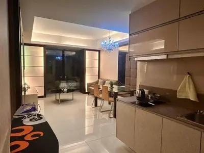 a kitchen with a table and a dining room at Chelsea Residence Studio, Plaza Damas 3 in Kuala Lumpur