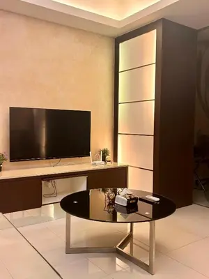 a living room with a desk with a tv and a table at Chelsea Residence Studio, Plaza Damas 3 in Kuala Lumpur