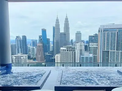 a view of a city skyline from a hot tub at The Colony By Infinitum KLCC in Kuala Lumpur