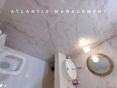 a bathroom with a sink and a toilet and a mirror at Arte Mon Kiara MK3 Royal Stylist Apartment, Walking Distance to Publika in Kuala Lumpur