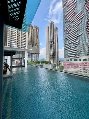 a pool of water in a city with tall buildings at Dreamscape By Reizz Residence in Kuala Lumpur