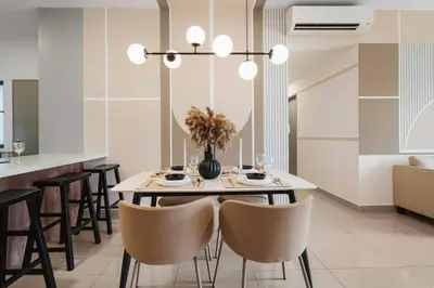 a dining room with a table and chairs at 4BR Modish Room MVertica Near MRT by RumaBnB in Kuala Lumpur