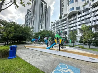 a park with playground equipment in a city at Vivo Soho Suite-5pax-Next to Midvalley, KL center in Kuala Lumpur