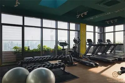 a gym with chairs and treadmills in a building at Riveria Premium Kuala Lumpur, Roam in Kuala Lumpur