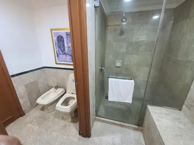 a bathroom with a shower and a toilet at Premier CityView Times Square Apartment KL in Kuala Lumpur