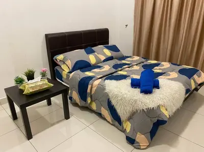 a bed with a blue stuffed animal on top of it at Ampang 4-5 pax in Ampang Point in Ampang