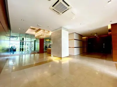 a large room with a lobby with a ceiling fan at 2br 2ba in the heart of KL, Regalia Residence in Kuala Lumpur