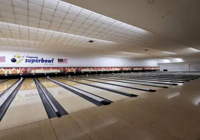 a row of bowling lanes in a bowling alley at Agile Signature Suites KL in Kuala Lumpur