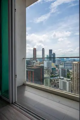 a view of a city from a window in a building at One Bukit Ceylon Bukit Bintang in Kuala Lumpur