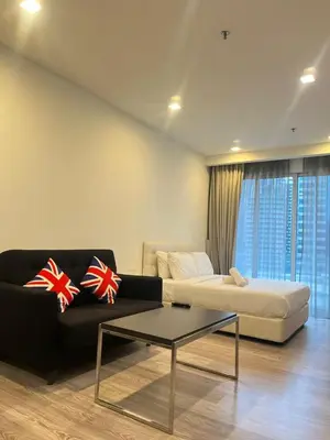 a living room with a couch and a coffee table at One Bukit Ceylon Bukit Bintang in Kuala Lumpur