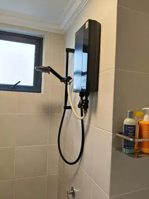 a television on a wall in a bathroom at M Centura Sentul Condominium Two Bedroom in Kuala Lumpur