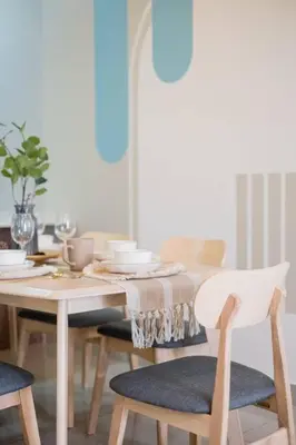 a dining room table with chairs and a table with a tablecloth at Bea Bea's Kidz Dreamland Mini Horse 4br 11pax MRT in Kuala Lumpur