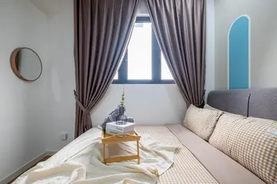 a bedroom with a bed with a table on it at Bea Bea's Kidz Dreamland Mini Horse 4br 11pax MRT in Kuala Lumpur