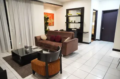 a living room with a couch and a table at The Luxe Apartment 2 Bedrooms in Kuala Lumpur