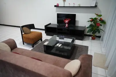 a living room with a couch and a coffee table at The Luxe Apartment 2 Bedrooms in Kuala Lumpur