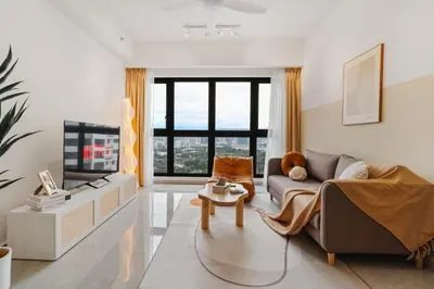 a living room with a couch and a tv at Agile Bukit Bintang in Kuala Lumpur