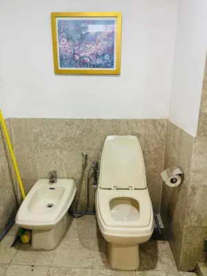 a bathroom with a toilet and a sink at Jalan imbi Suites At Times Square KL in Kuala Lumpur