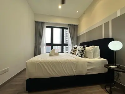a bedroom with a large bed with a window at Agile Bukit Bintang by Romeo Bnb in Kuala Lumpur