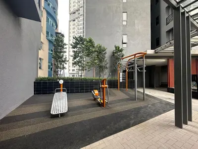 a playground in the middle of a city with buildings at Agile Bukit Bintang by Romeo Bnb in Kuala Lumpur
