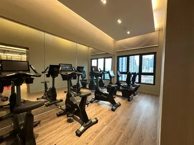 a gym with treadmills and exercise bikes in a room at Agile Bukit Bintang by Romeo Bnb in Kuala Lumpur