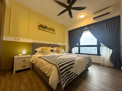 a bedroom with a bed and a ceiling fan at Agile Bukit Bintang by Romeo Bnb in Kuala Lumpur