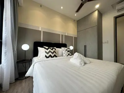 a bedroom with a large white bed with two pillows at Agile Bukit Bintang by Romeo Bnb in Kuala Lumpur