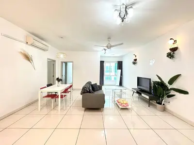 a living room with a couch and a table at VR3 Sunway Velocity Spacious Apt\u4e2d\u6587\u623f\u6771 in Kuala Lumpur