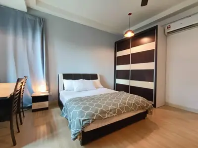 a bedroom with a bed and a desk and a table at VR3 Sunway Velocity Spacious Apt\u4e2d\u6587\u623f\u6771 in Kuala Lumpur