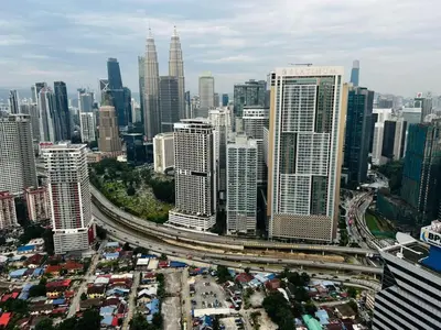 an overhead view of a large city with traffic at Alaman Luxe suites KLCC in Kuala Lumpur