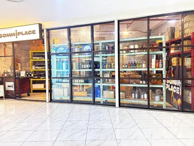 a store filled with lots of bottles of alcohol at Alaman Luxe suites KLCC in Kuala Lumpur