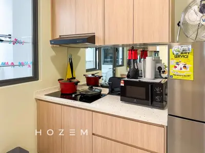 a kitchen with a stove and a microwave at 3BR3B Hozem KL4523 Apartment Segambut in Kuala Lumpur