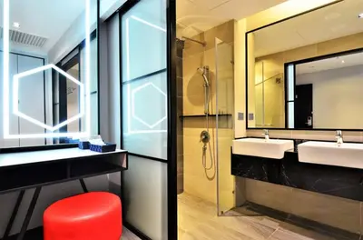 a bathroom with two sinks and a mirror at Menara M101 Dang Wangi Kuala Lumpur in Kuala Lumpur