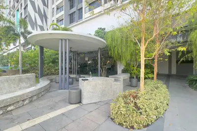a building with a tree in front of a building at Comfy studio suite Free Parking Netflix Trion C3208St KL in Kuala Lumpur