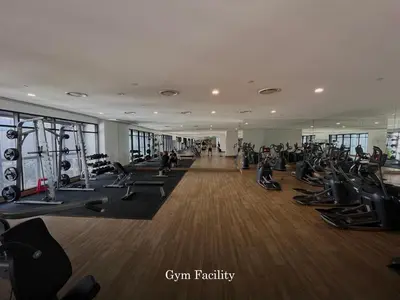 a gym with lots of treadmills and people in it at Scenic Garden Balcony EST Bangsar Studio for 2 in Kuala Lumpur