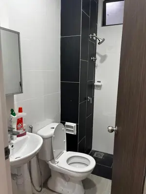 a bathroom with a white toilet and a sink at Seasons Gardens Wangsa Maju, KL - 3 bedroom apartment in Kuala Lumpur