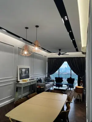 a living room with a table and a couch at Seasons Gardens Wangsa Maju, KL - 3 bedroom apartment in Kuala Lumpur