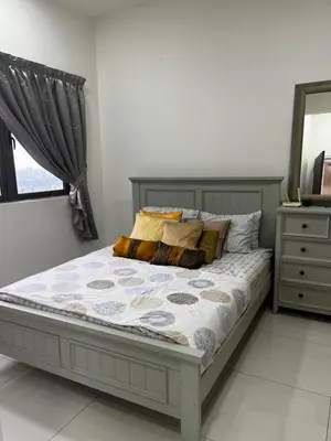 a bedroom with a bed and a mirror and a dresser at Seasons Gardens Wangsa Maju, KL - 3 bedroom apartment in Kuala Lumpur