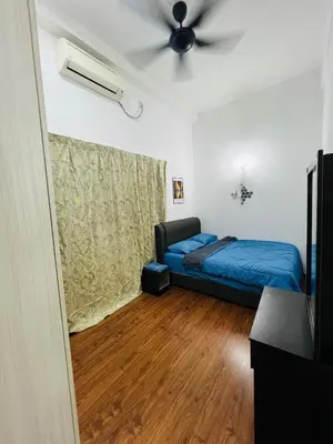 a bedroom with a bed and a ceiling fan at VUE Residences Hkl Klcc view in Kuala Lumpur