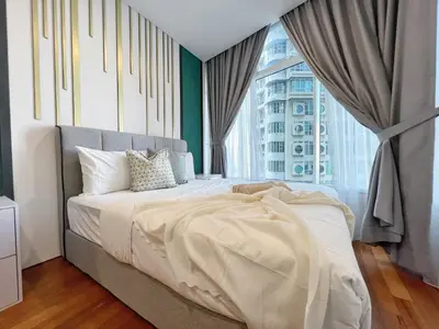 a bedroom with a large bed and a large window at Sky Suites Dreamy 3BR Suite at KLCC in Kuala Lumpur