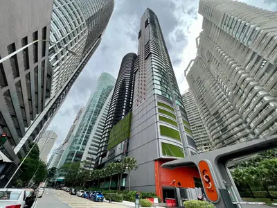 a group of tall buildings in a city at Sky Suites Dreamy 3BR Suite at KLCC in Kuala Lumpur