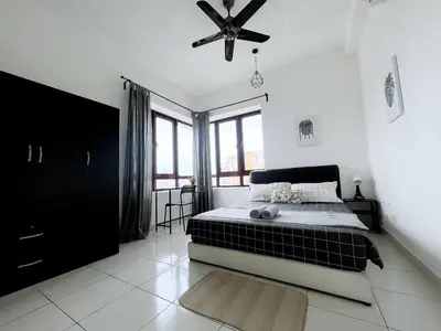 a bedroom with a bed and a ceiling fan at Rafflesia KL Big Family 3BR Condo Near LRT in Kuala Lumpur