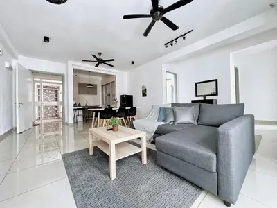 a living room with a couch and a table at Rafflesia KL Big Family 3BR Condo Near LRT in Kuala Lumpur