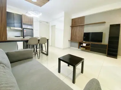 a living room with a couch and a table at Arte mont kiara by Happy stay in Kuala Lumpur