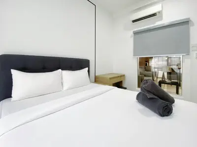 a bedroom with a white bed and a window at Arte mont kiara by Happy stay in Kuala Lumpur