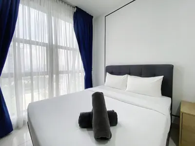 a bedroom with a white bed with a large window at Arte mont kiara by Happy stay in Kuala Lumpur