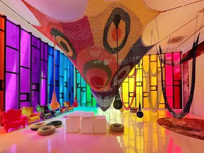 a room with a colorful wall with windows at Arte mont kiara by Happy stay in Kuala Lumpur