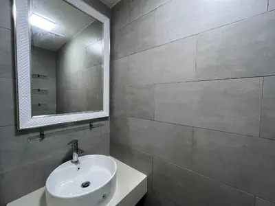 a bathroom with a white sink and a mirror at Arte mont kiara by Happy stay in Kuala Lumpur