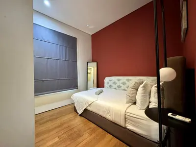 a bedroom with a bed and a large window at Sky Suites Lovely 3BR Suite at KLCC in Kuala Lumpur